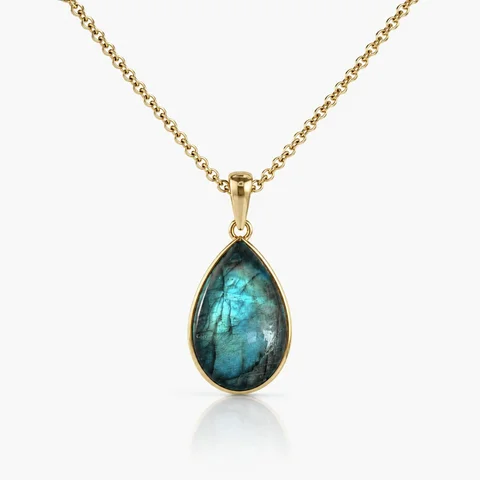 Intuition Necklace with a teardrop labradorite pendant in a brass setting
